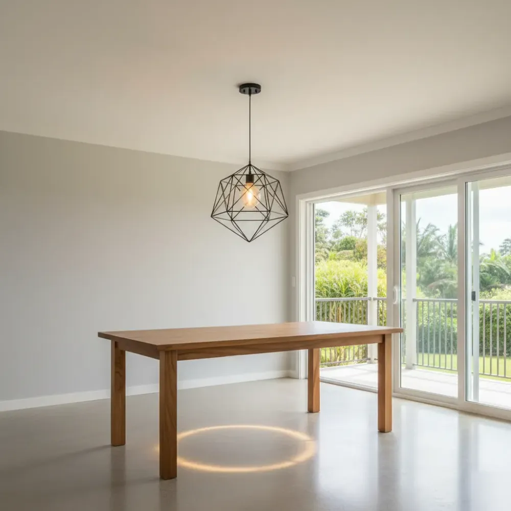 Completed pendant light fixture installation above dining table in Oahu home